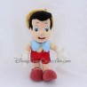 Peluche articulée Pinocchio DISNEYLAND PARIS petit garçon pantin de bois Disney 34 cm