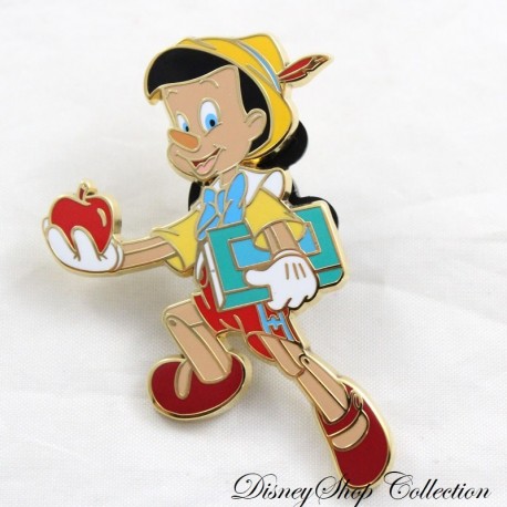 Pin's Pinocchio DISNEYLAND PARIS livre d'école et pomme Pin Trading