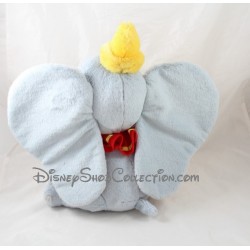 Peluche elefante Dumbo Disneylandia París cuello a rojo sombrero Disney 32 cm amarillo